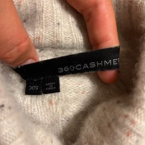 360 Cashmere cropped turtleneck sweater.